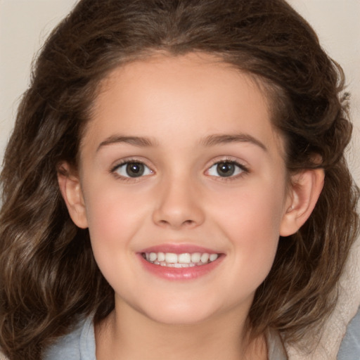 Joyful white child female with medium  brown hair and brown eyes