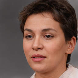 Joyful white adult female with short  brown hair and brown eyes