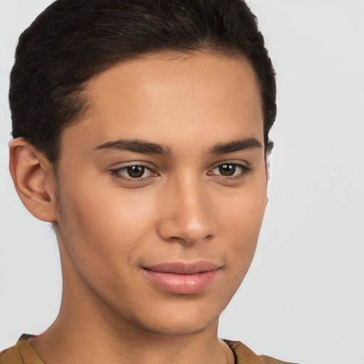 Joyful latino young-adult male with short  brown hair and brown eyes