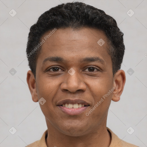 Joyful latino young-adult male with short  brown hair and brown eyes