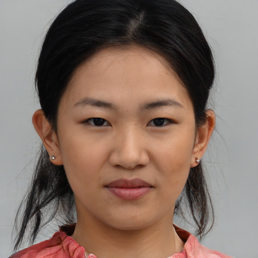 Joyful asian young-adult female with medium  brown hair and brown eyes