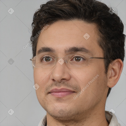 Joyful white adult male with short  brown hair and brown eyes