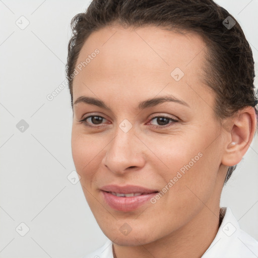 Joyful white young-adult female with short  brown hair and brown eyes