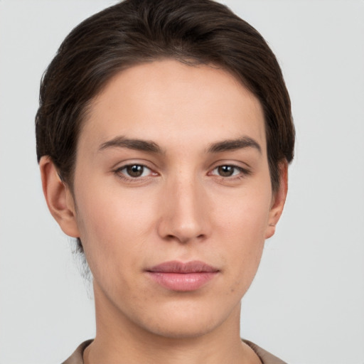 Neutral white young-adult female with short  brown hair and brown eyes