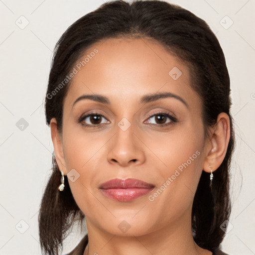 Joyful latino young-adult female with long  brown hair and brown eyes