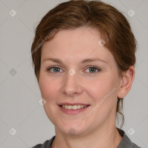 Joyful white young-adult female with medium  brown hair and blue eyes