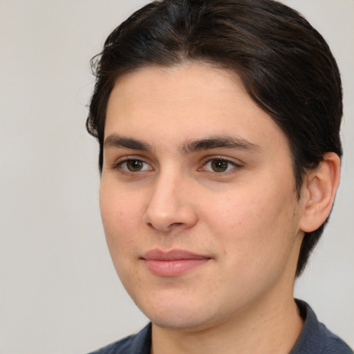 Joyful white young-adult male with medium  brown hair and brown eyes