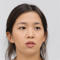 Neutral asian young-adult female with medium  brown hair and brown eyes