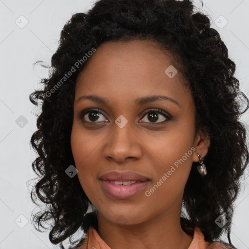 Joyful black young-adult female with long  brown hair and brown eyes