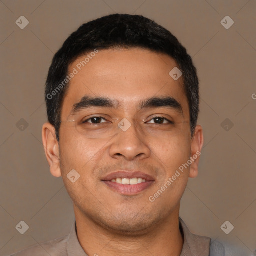 Joyful latino young-adult male with short  brown hair and brown eyes