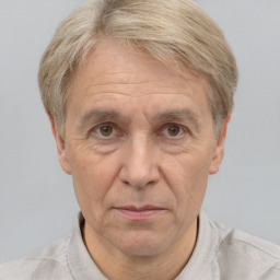 Joyful white middle-aged male with short  gray hair and grey eyes