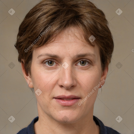 Joyful white adult female with short  brown hair and grey eyes