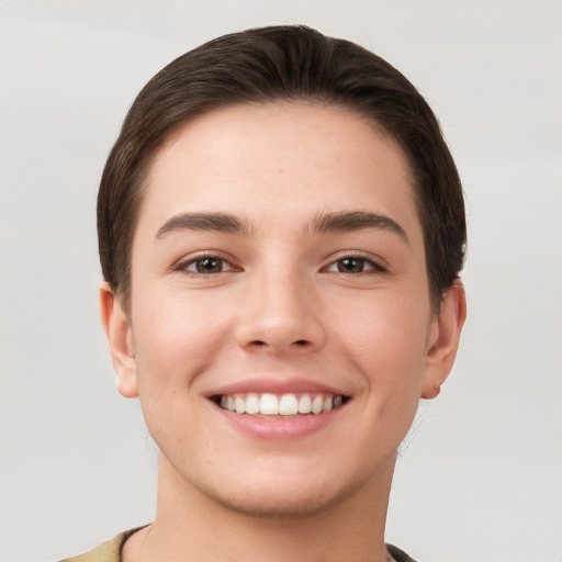 Joyful white young-adult female with short  brown hair and brown eyes