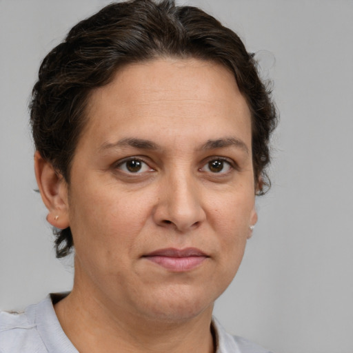 Joyful white adult female with short  brown hair and brown eyes