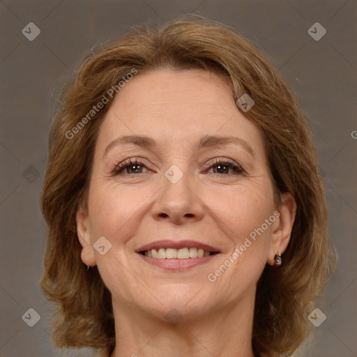 Joyful white adult female with medium  brown hair and brown eyes