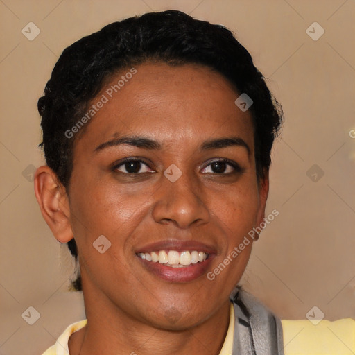 Joyful black young-adult female with short  black hair and brown eyes