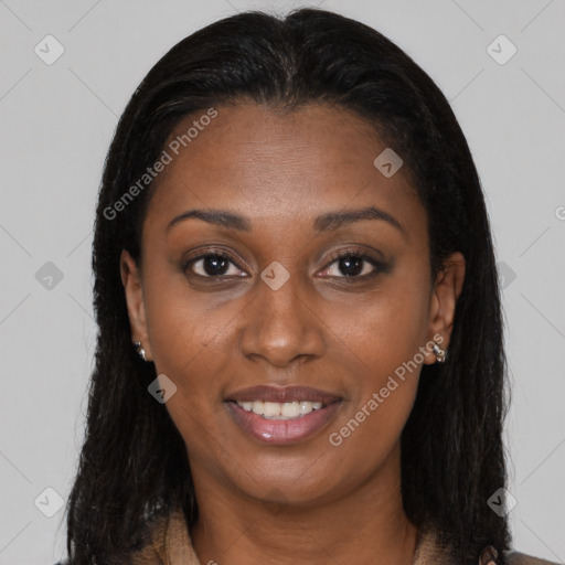 Joyful black young-adult female with long  brown hair and brown eyes