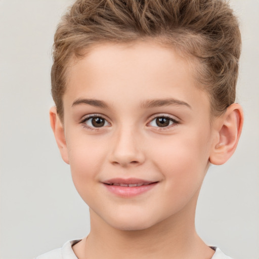 Joyful white child male with short  brown hair and brown eyes