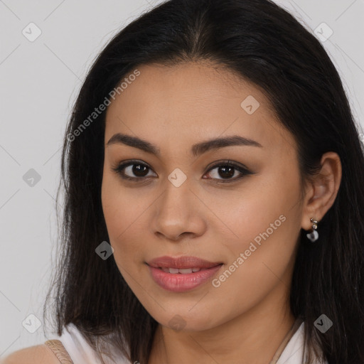 Joyful latino young-adult female with long  brown hair and brown eyes