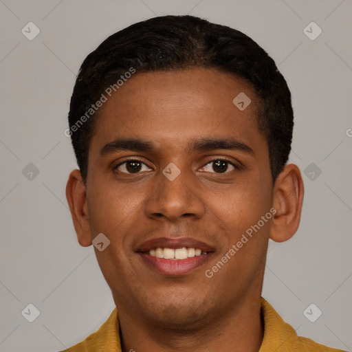 Joyful black young-adult male with short  brown hair and brown eyes