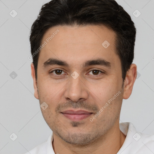 Joyful white young-adult male with short  black hair and brown eyes