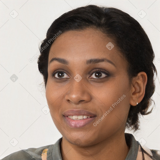 Joyful black young-adult female with medium  black hair and brown eyes