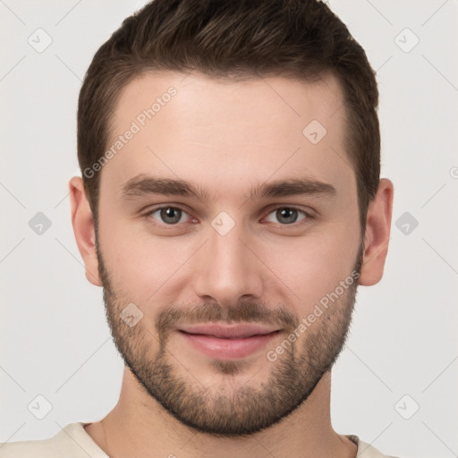 Joyful white young-adult male with short  brown hair and brown eyes