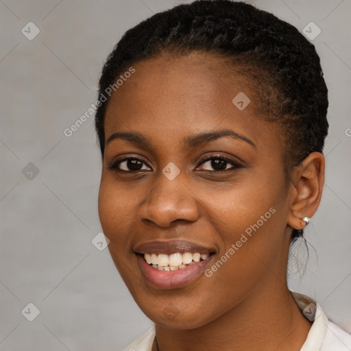 Joyful black young-adult female with short  brown hair and brown eyes