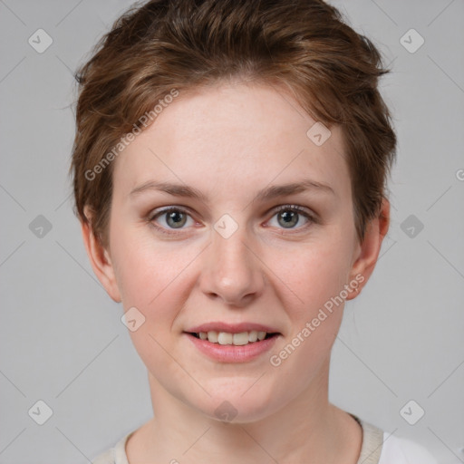 Joyful white young-adult female with short  brown hair and grey eyes