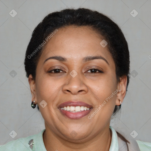 Joyful latino adult female with short  brown hair and brown eyes