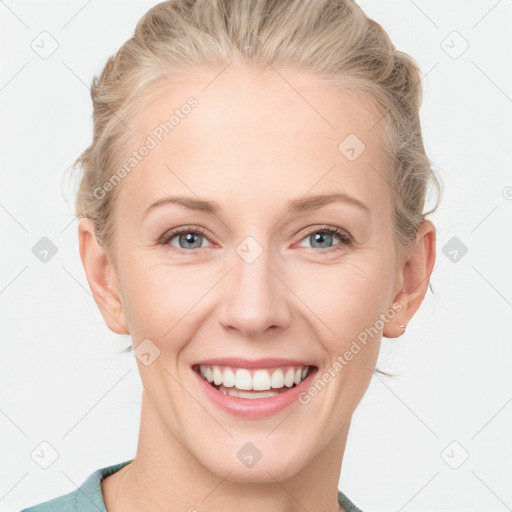 Joyful white young-adult female with short  brown hair and blue eyes