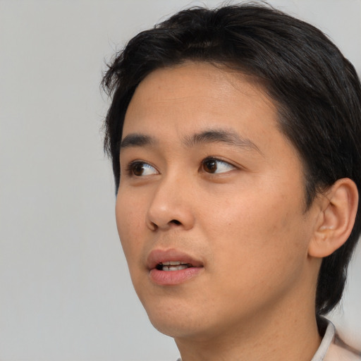 Neutral asian young-adult male with short  black hair and brown eyes