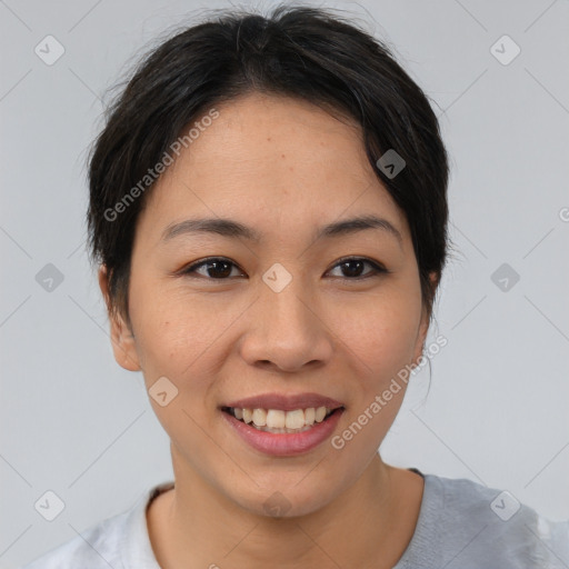 Joyful asian young-adult female with short  brown hair and brown eyes