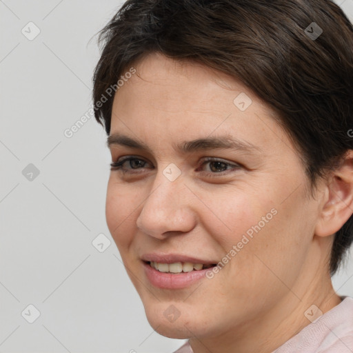 Joyful white young-adult female with short  brown hair and brown eyes