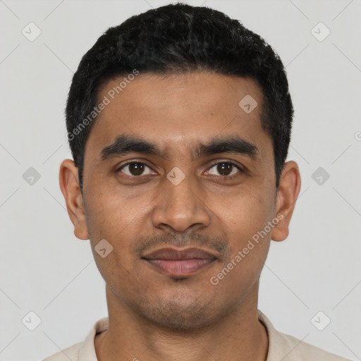 Joyful latino young-adult male with short  black hair and brown eyes