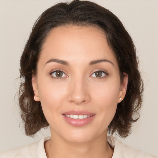 Joyful white young-adult female with medium  brown hair and brown eyes