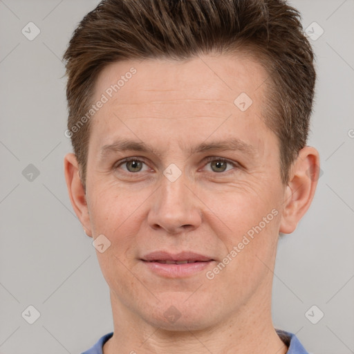 Joyful white adult male with short  brown hair and grey eyes