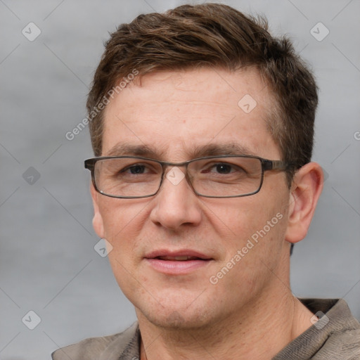 Joyful white adult male with short  brown hair and grey eyes