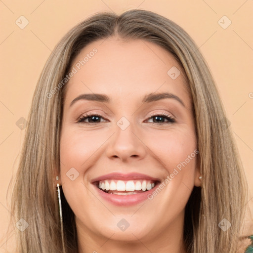 Joyful white young-adult female with long  brown hair and brown eyes