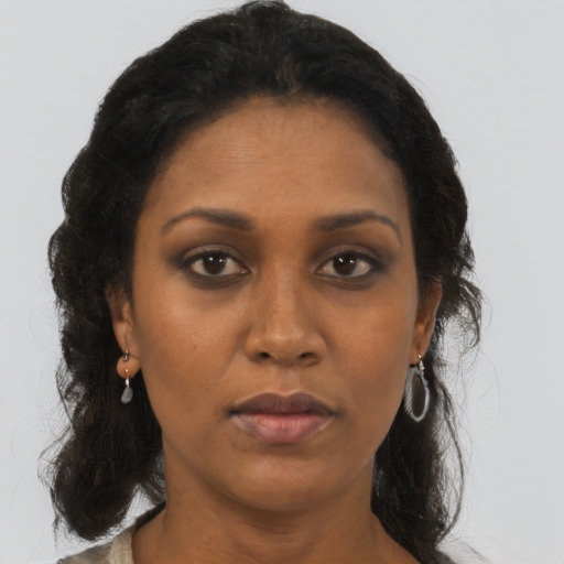 Neutral black adult female with long  brown hair and brown eyes
