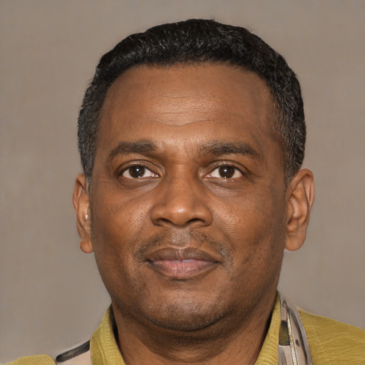 Neutral latino adult male with short  black hair and brown eyes