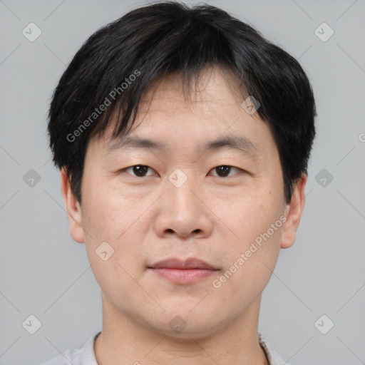 Neutral asian adult male with short  brown hair and brown eyes