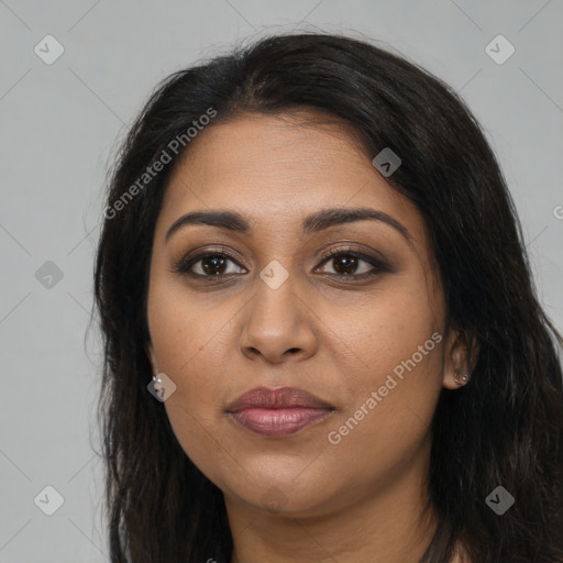 Joyful latino young-adult female with long  brown hair and brown eyes