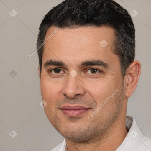 Joyful white young-adult male with short  black hair and brown eyes