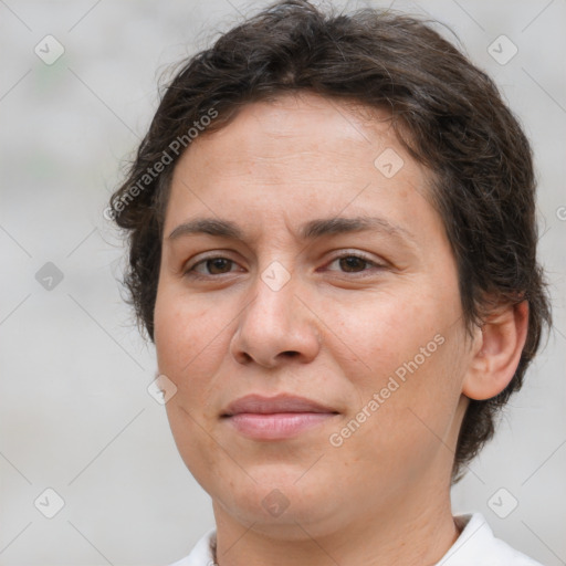 Joyful white adult female with short  brown hair and brown eyes