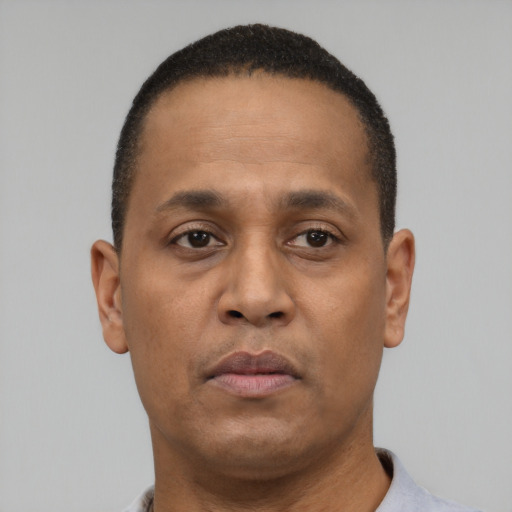 Neutral black adult male with short  brown hair and brown eyes