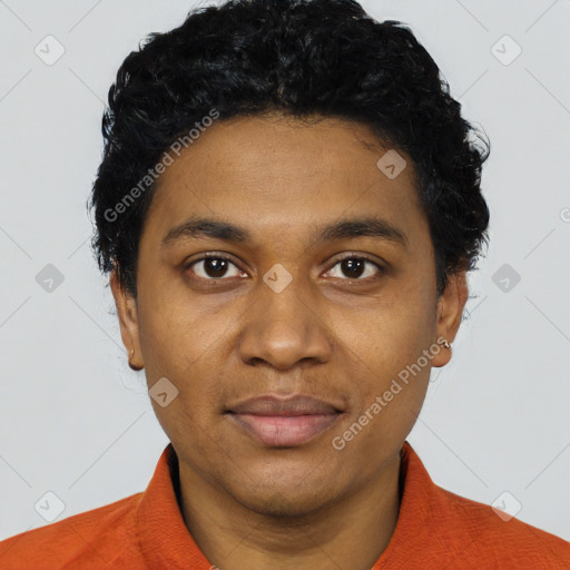 Joyful black young-adult male with short  black hair and brown eyes