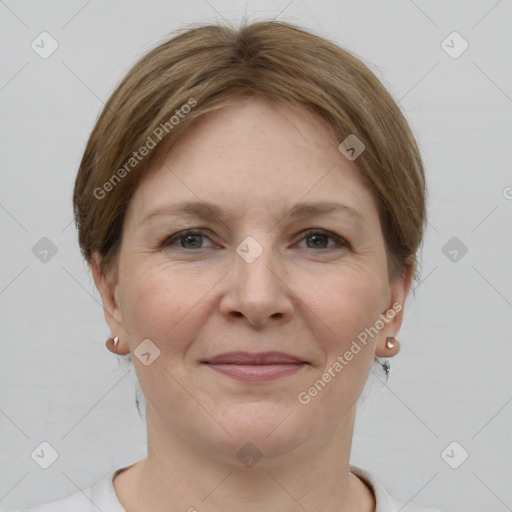 Joyful white adult female with short  brown hair and grey eyes