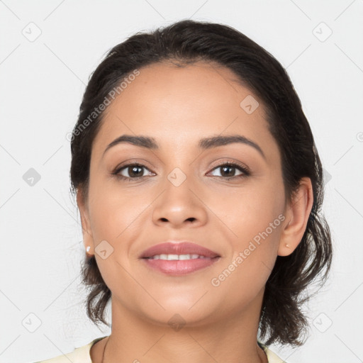 Joyful latino young-adult female with medium  black hair and brown eyes