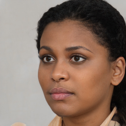 Neutral black young-adult female with short  brown hair and brown eyes
